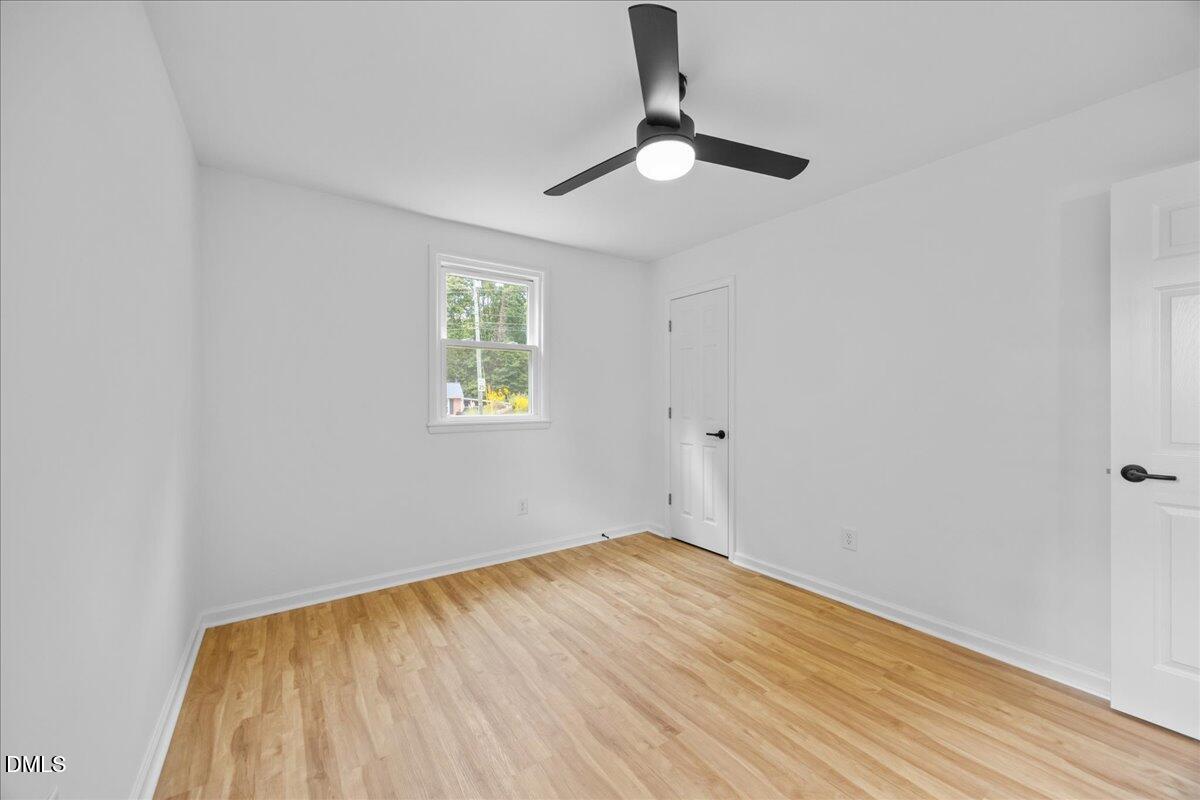 3437 Apache Drive Raleigh, NC 27609 - Photo 19 of 33 a view of empty room with wooden floor