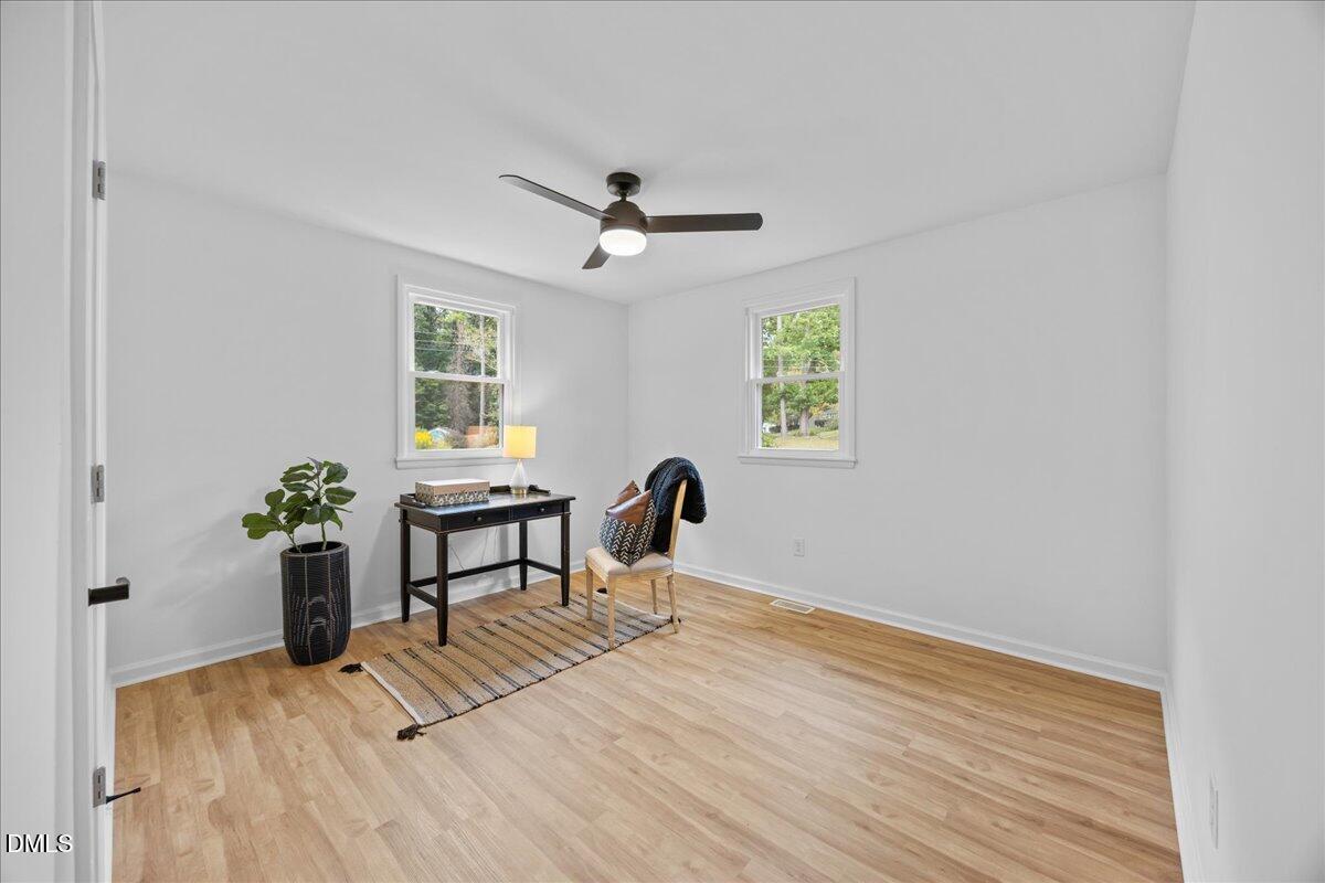 3437 Apache Drive Raleigh, NC 27609 - Photo 20 of 33 a living room with furniture and a potted plant