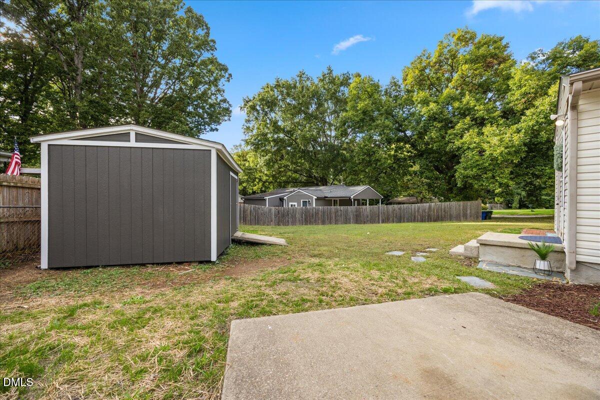 3437 Apache Drive Raleigh, NC 27609 - Photo 26 of 33 a backyard of a house with lots of green space