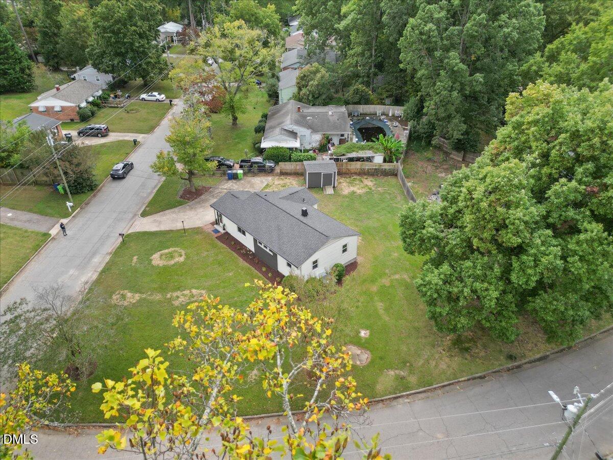 3437 Apache Drive Raleigh, NC 27609 - Photo 31 of 33 an aerial view of a house with garden space and trees all around