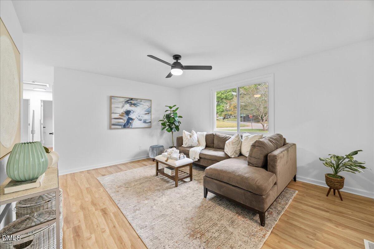 3437 Apache Drive Raleigh, NC 27609 - Photo 9 of 33 a living room with furniture and a large window