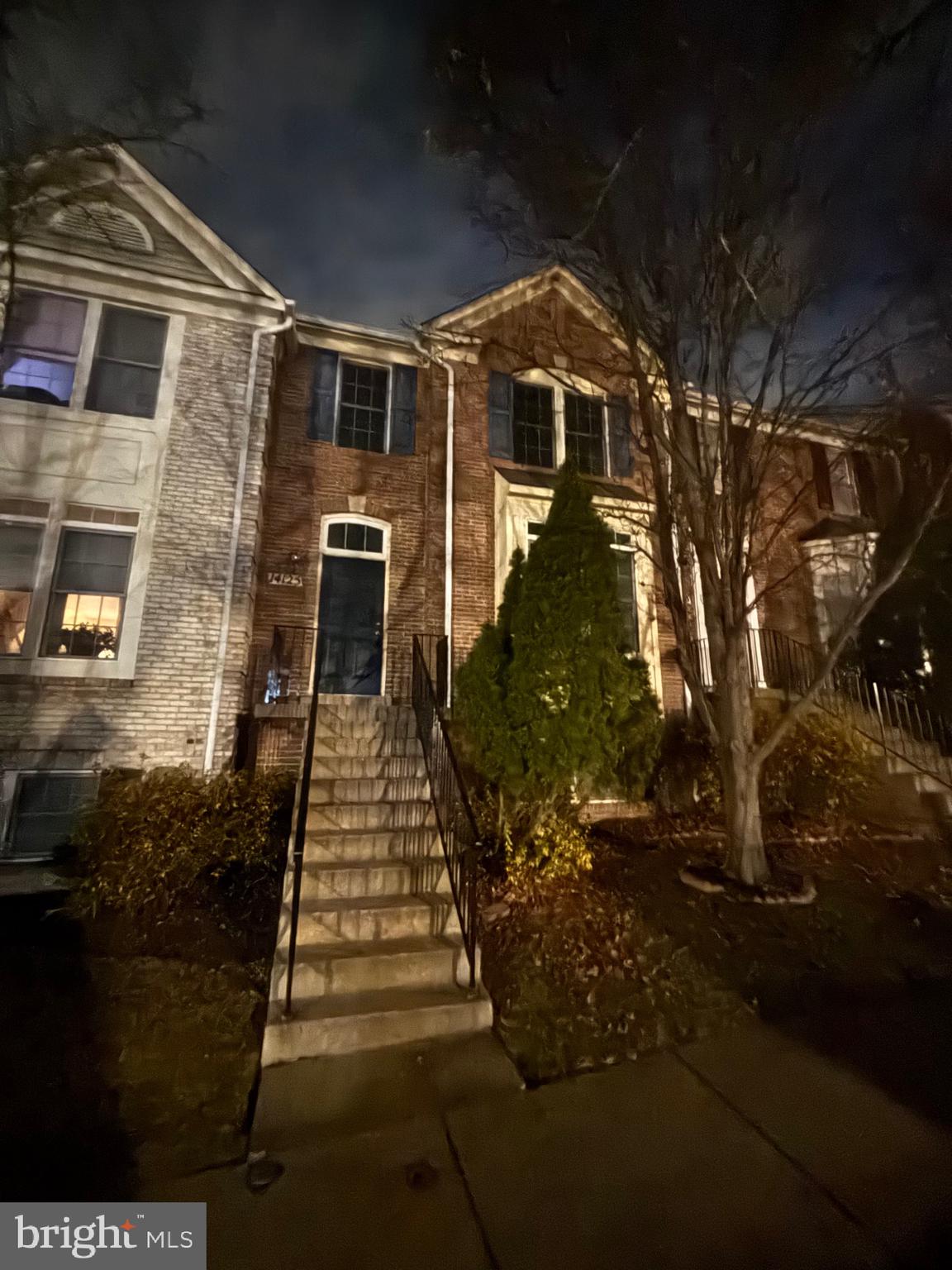 14125 Parker Farm Way Silver Spring, MD 20906 - Photo 2 of 2 a front view of a house with a yard