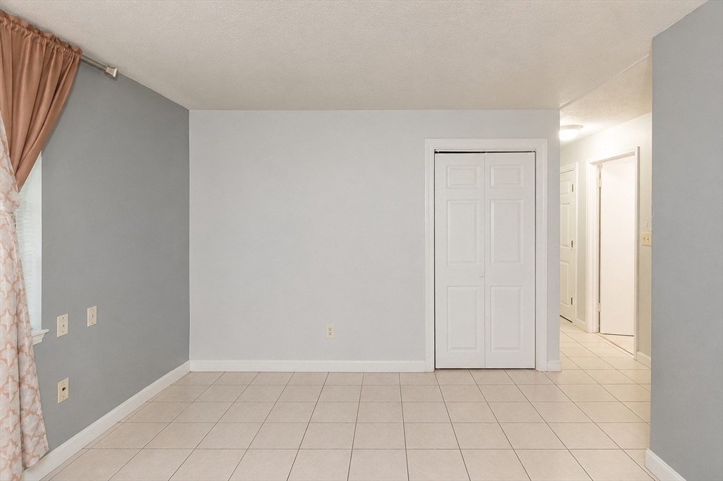 2 Universal Street, Unit 4 Framingham, MA 01702 - Photo 5 of 18 a view of an empty room and window