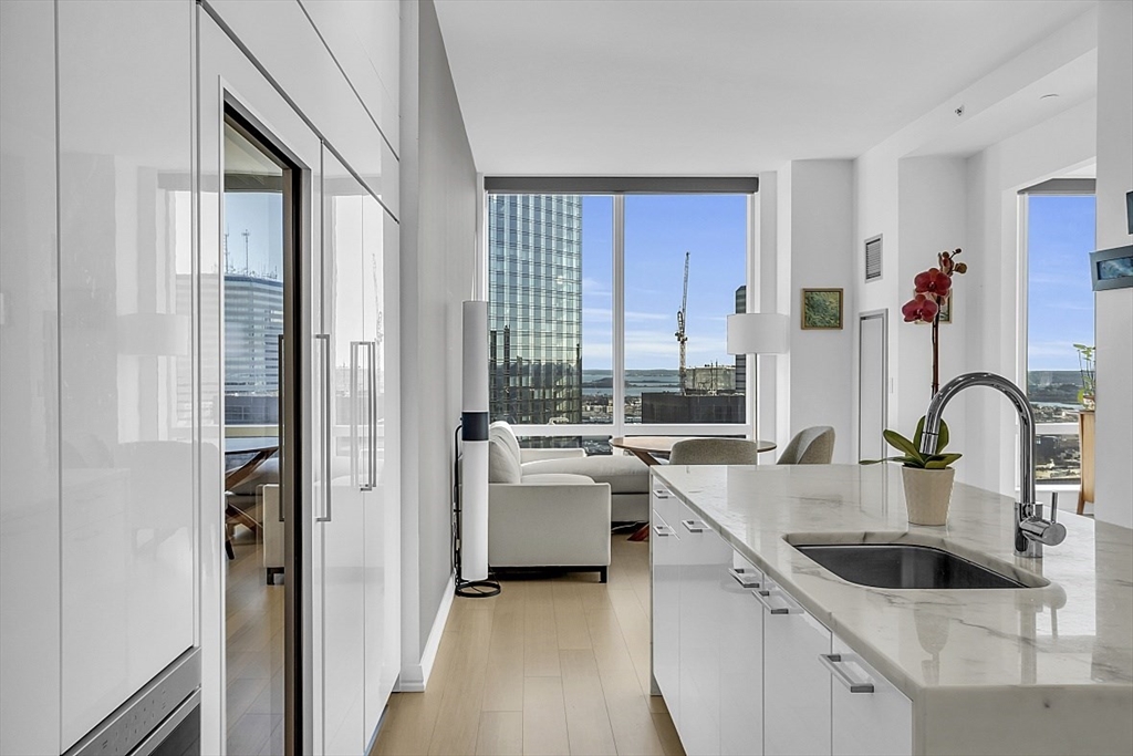 1 Franklin Street, Unit 4606 Boston, MA 02110 - Photo 11 of 38 a kitchen with a sink and a refrigerator