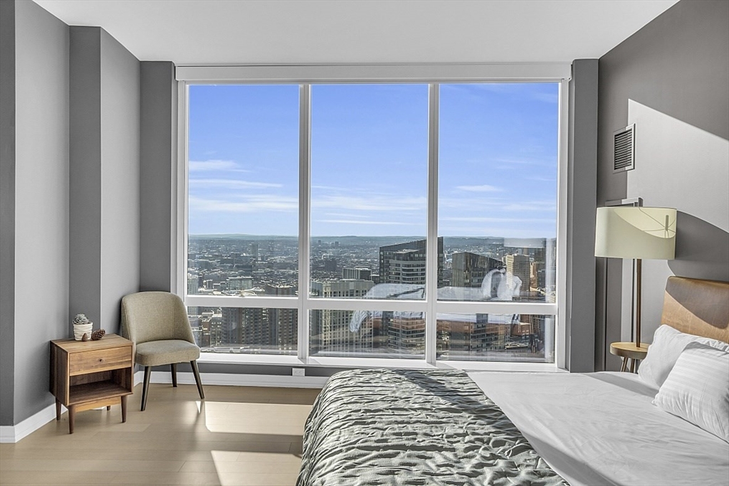 1 Franklin Street, Unit 4606 Boston, MA 02110 - Photo 16 of 38 a living room with furniture and a large window