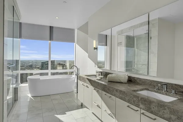 a bathroom with a bathtub and shower