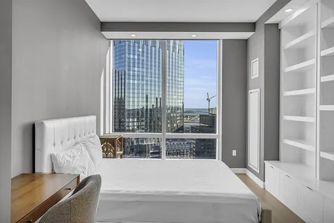 a bathroom with a shower sink and mirror