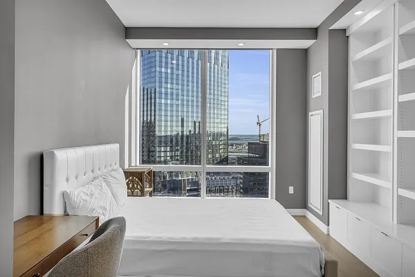 a bathroom with a shower sink and mirror