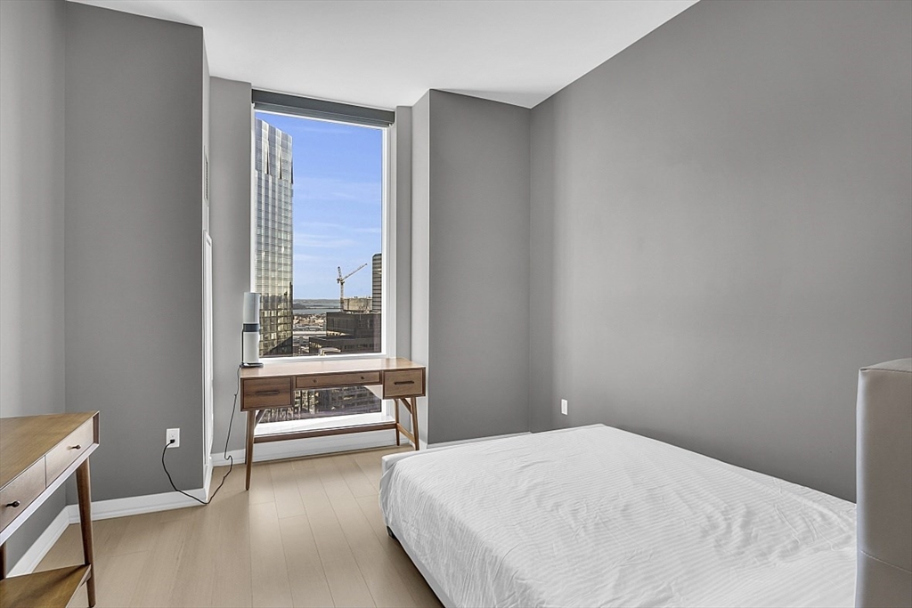 1 Franklin Street, Unit 4606 Boston, MA 02110 - Photo 23 of 38 a bedroom with a bed and with a window
