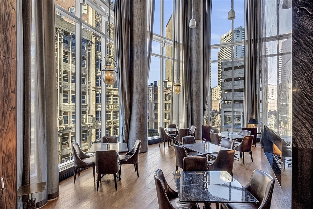 1 Franklin Street, Unit 4606 Boston, MA 02110 - Photo 24 of 38 a view of a dining room with furniture window and outside view