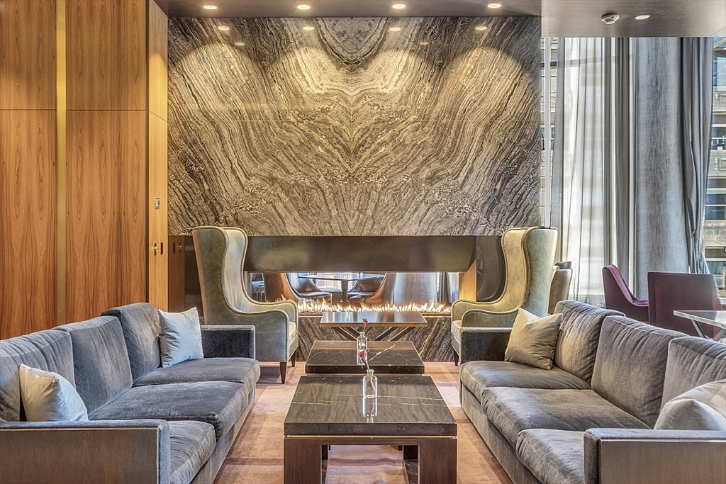 1 Franklin Street, Unit 4606 Boston, MA 02110 - Photo 25 of 38 a living room with furniture and a large window