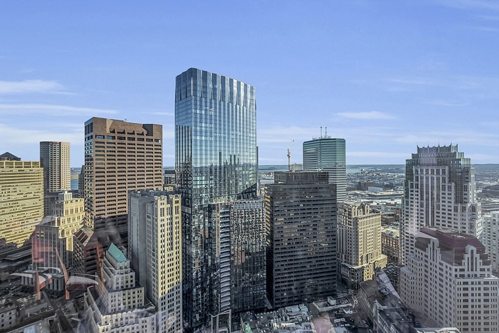 1 Franklin Street, Unit 4606 Boston, MA 02110 - Photo 36 of 38 a city view with tall buildings
