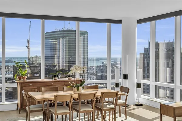 a living room with a large window and table