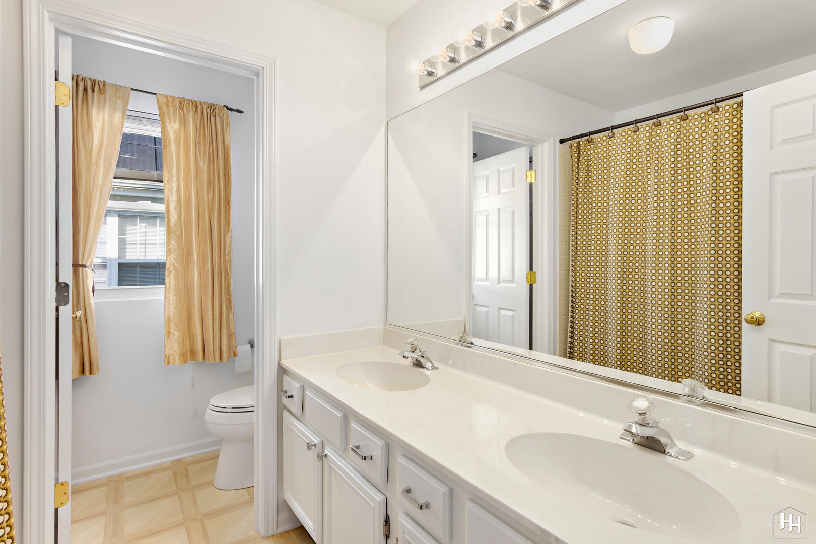 420 5th Street Wheeling, IL 60090 - Photo 25 of 34 a bathroom with a double vanity sink toilet and a mirror