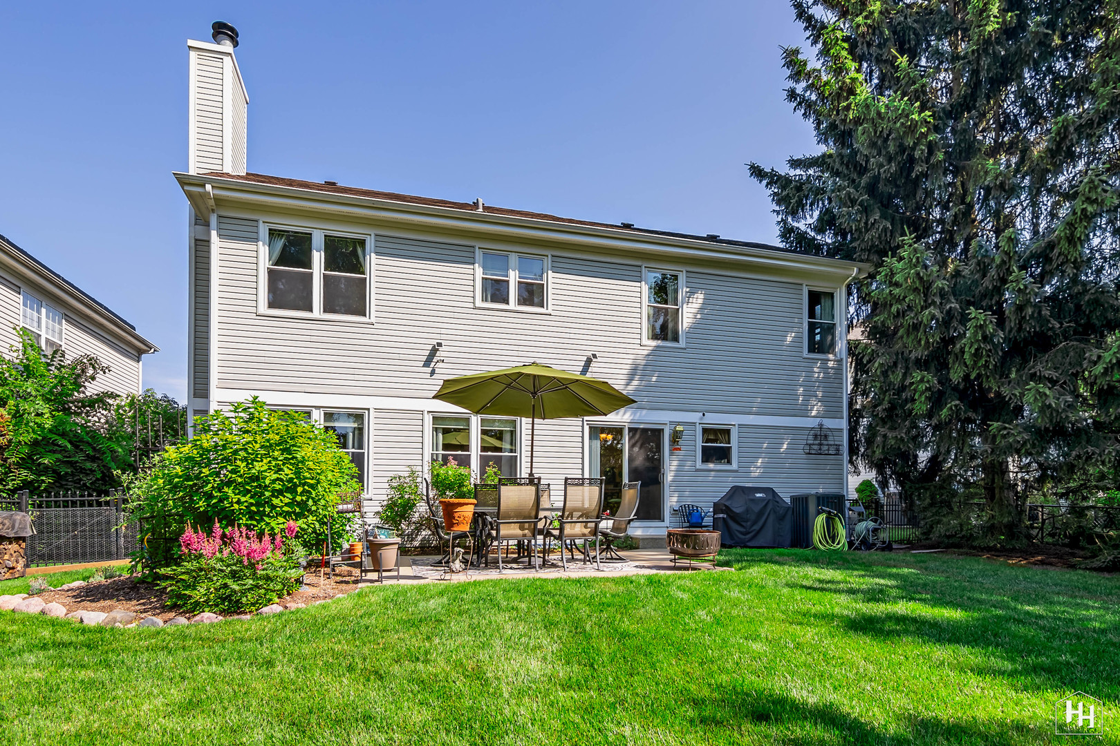420 5th Street Wheeling, IL 60090 - Photo 28 of 34 a view of a house with a backyard and sitting area