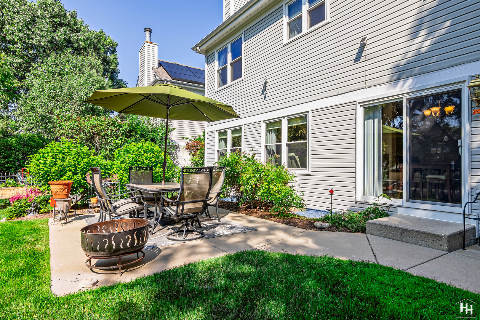 420 5th Street Wheeling, IL 60090 - Photo 30 of 34 a view of a chair and table under an umbrella
