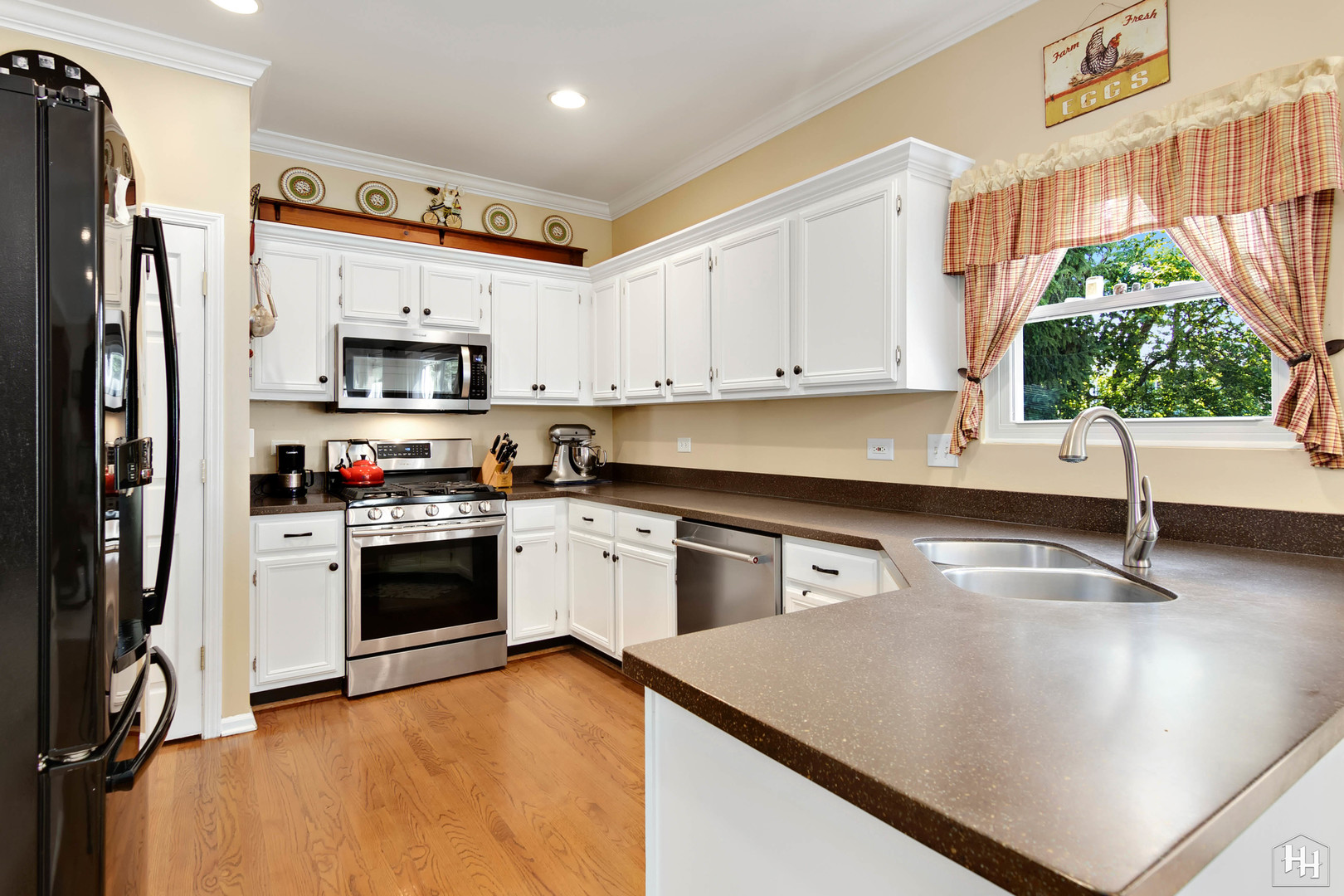 420 5th Street Wheeling, IL 60090 - Photo 4 of 34 a kitchen with stainless steel appliances granite countertop a sink a stove and a refrigerator