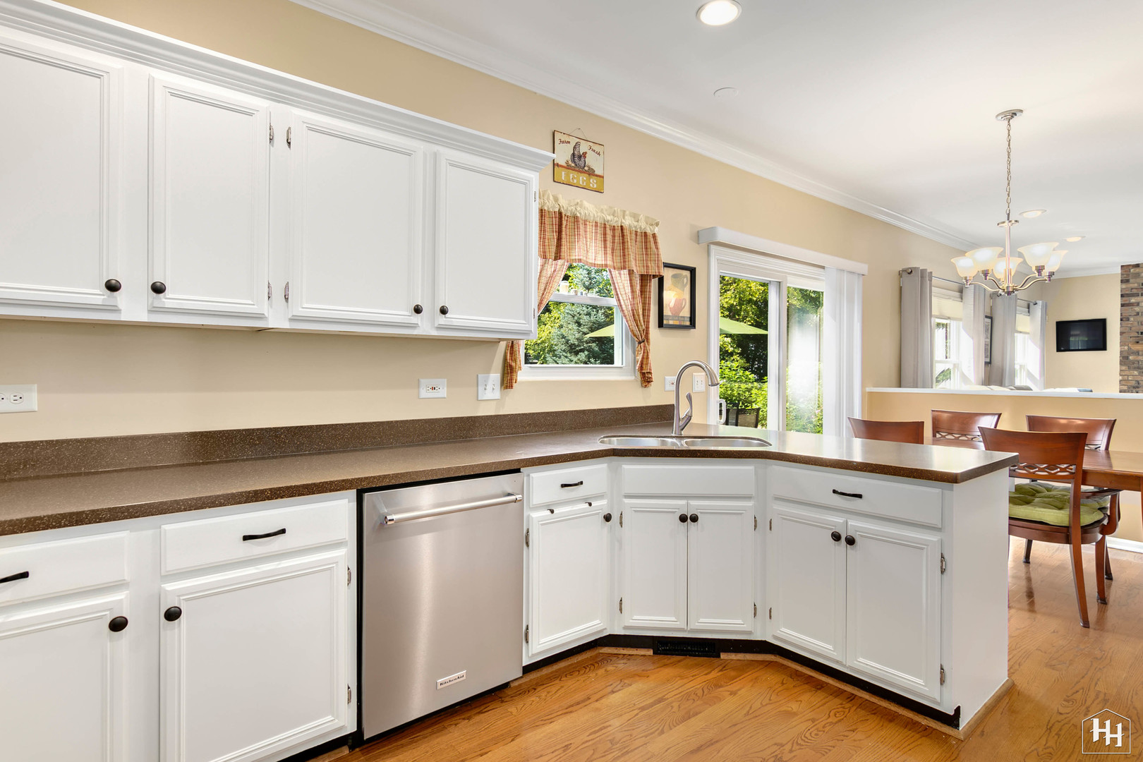 420 5th Street Wheeling, IL 60090 - Photo 5 of 34 a kitchen with granite countertop white cabinets and white appliances