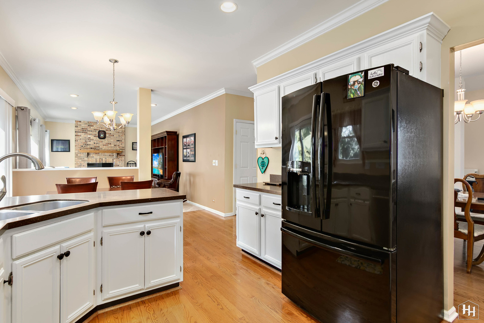 420 5th Street Wheeling, IL 60090 - Photo 6 of 34 a kitchen with a refrigerator a sink cabinets and stainless steel appliances