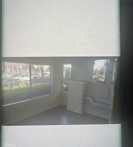 a view of hall way with wooden floor