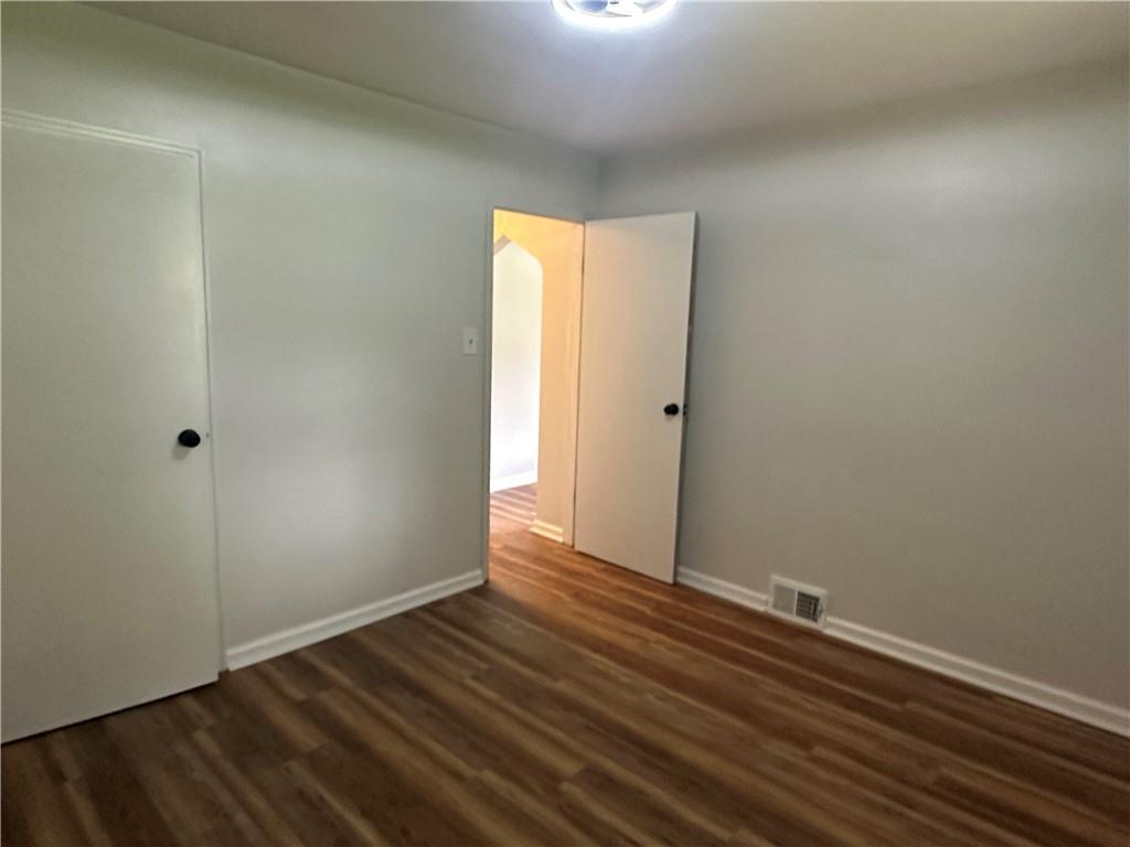 201 Clever Road McKees Rocks, PA 15136 - Photo 19 of 30 a view of an empty room with wooden floor and a window