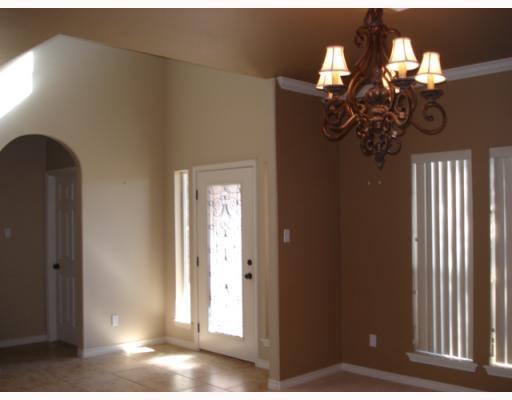213 Country Club Boulevard Portland, TX 78374 - Photo 4 of 10 a view of a chandelier fan and windows