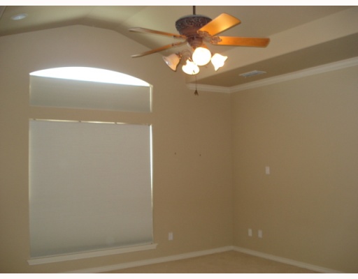 213 Country Club Boulevard Portland, TX 78374 - Photo 5 of 10 a view of a chandelier fan in a bathroom
