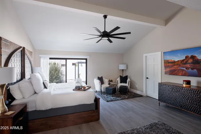 a bedroom with bed and window