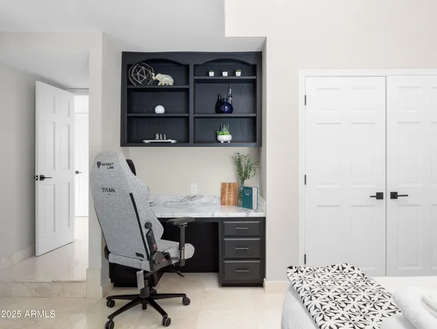 a bathroom with a double vanity sink toilet and shower