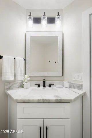 a kitchen with stainless steel appliances a stove a refrigerator and a sink