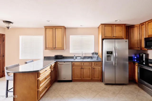 a bedroom with a bed couch and window