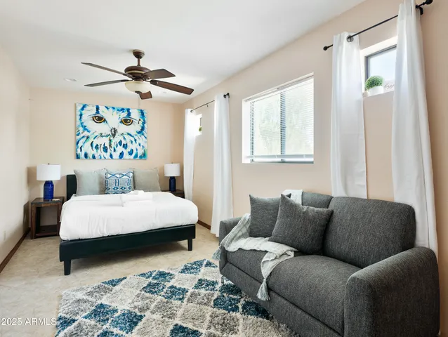 a bedroom with a bed and window