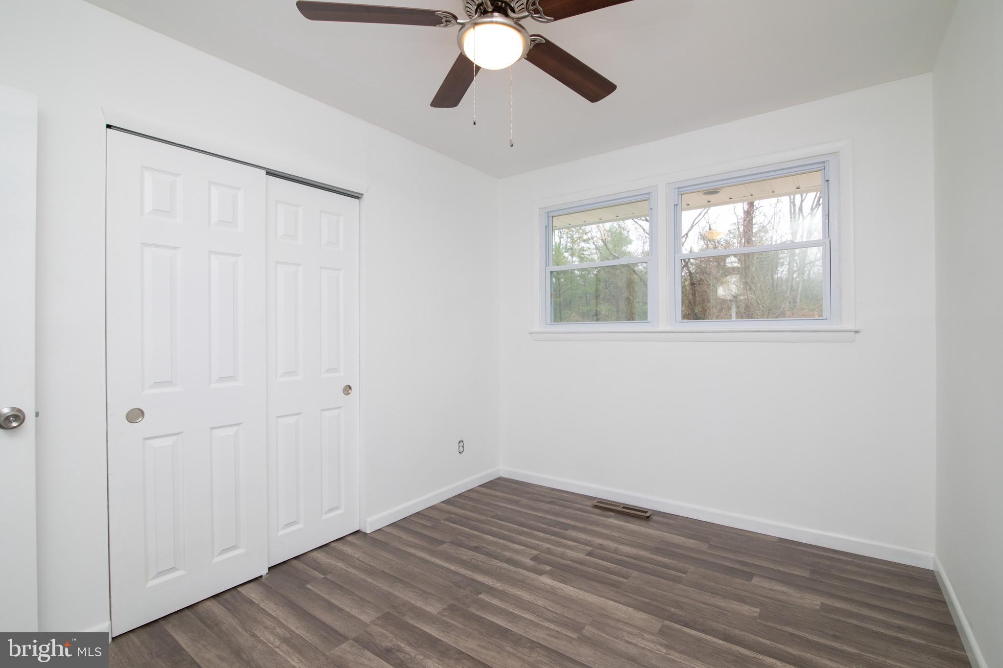 112 Country Club Road Pine Hill, NJ 08021 - Photo 12 of 22 wooden floor in an empty room with a window