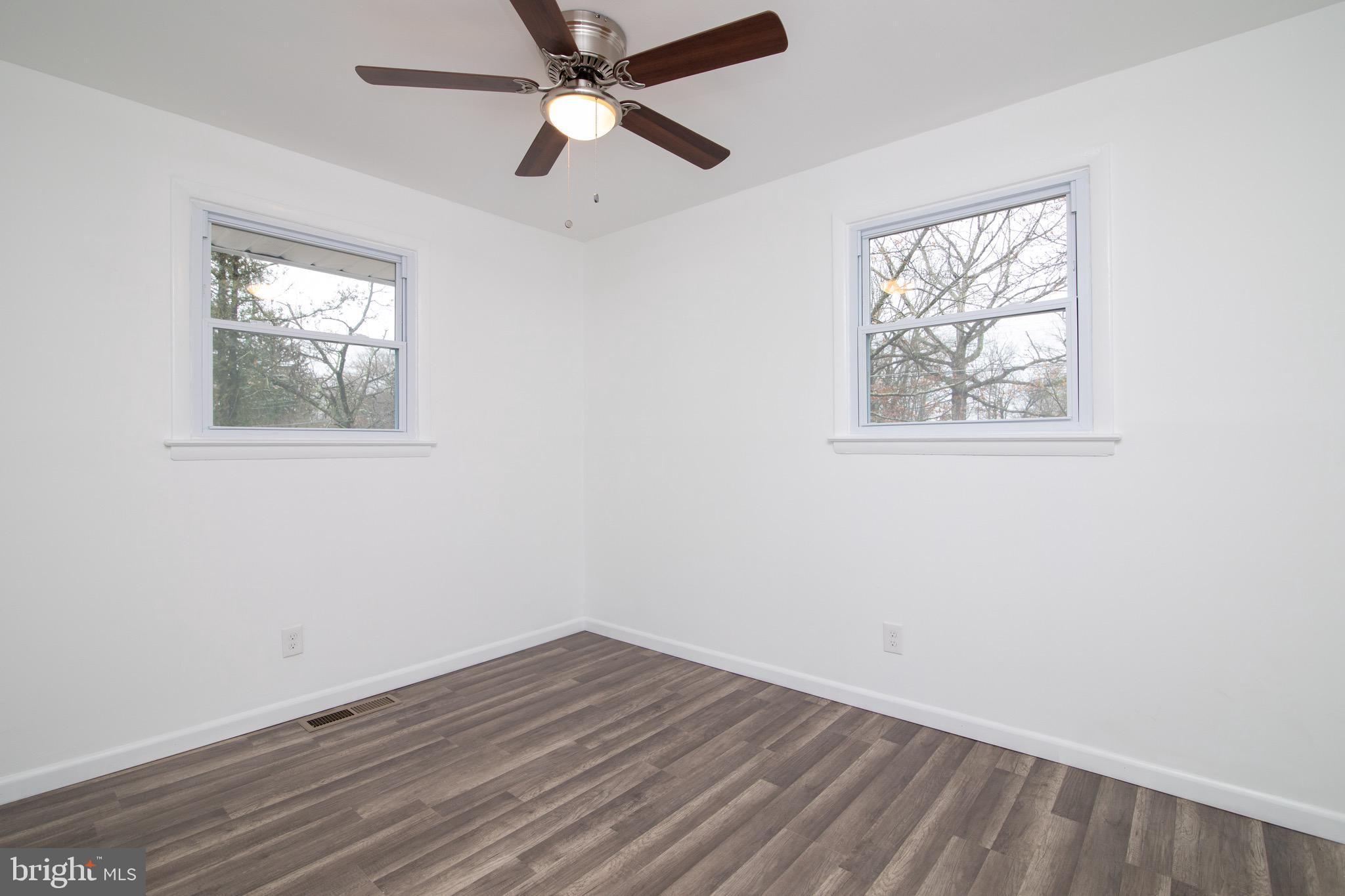 112 Country Club Road Pine Hill, NJ 08021 - Photo 13 of 22 wooden floor in an empty room with a window