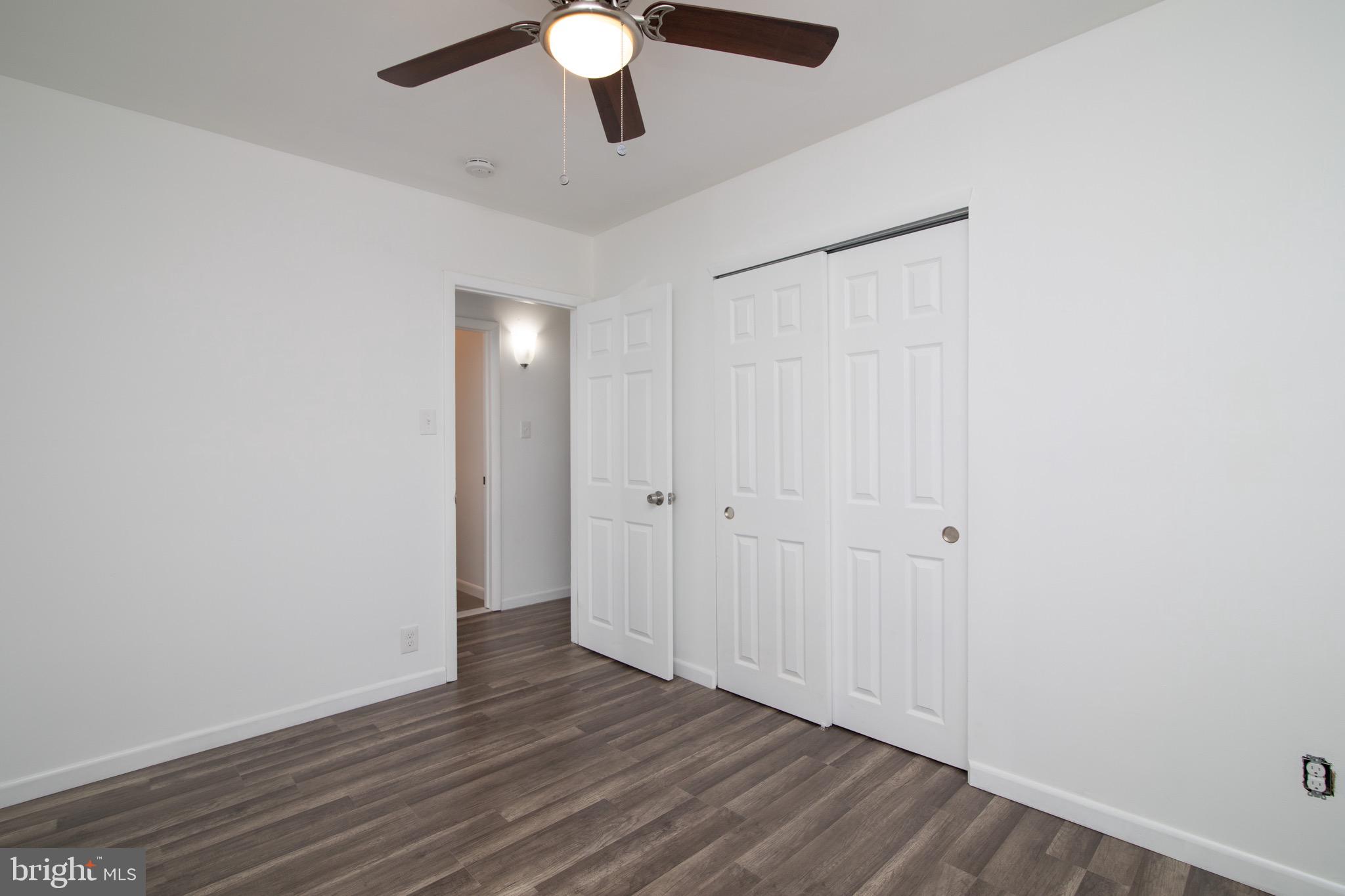 112 Country Club Road Pine Hill, NJ 08021 - Photo 19 of 22 a view of an empty room with wooden floor