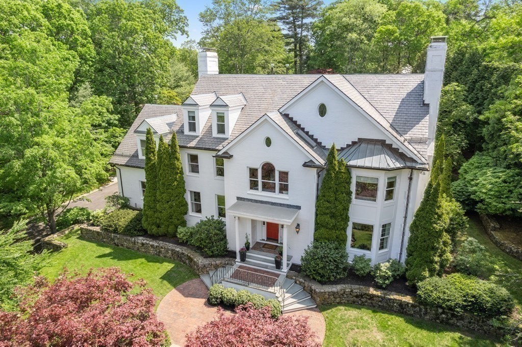 82 Sargent Road Brookline, MA 02445 - Photo 2 of 41 a view of a white house next to a yard with large trees