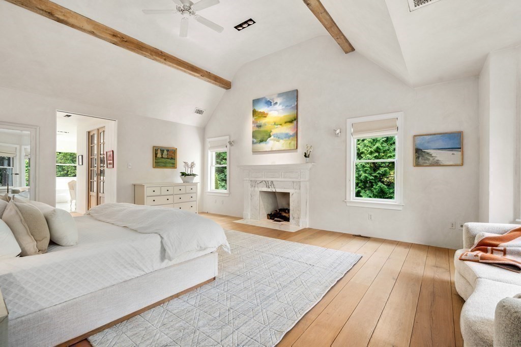 82 Sargent Road Brookline, MA 02445 - Photo 24 of 41 a spacious bedroom with a bed and a fireplace