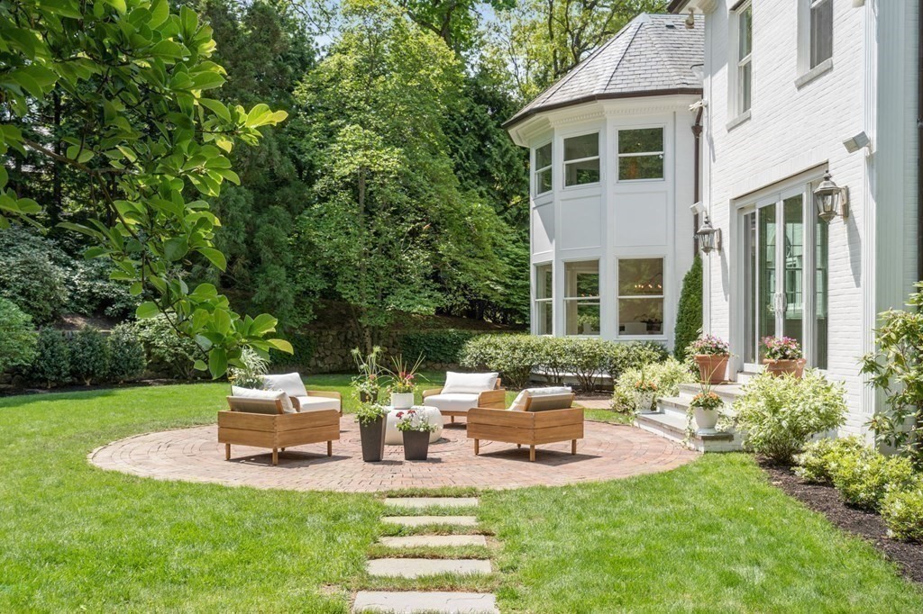 82 Sargent Road Brookline, MA 02445 - Photo 35 of 41 a view of a house with backyard sitting area and garden