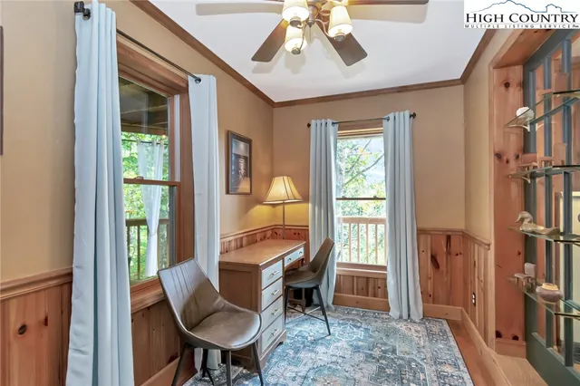 a view of a livingroom with furniture and a window
