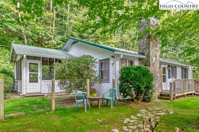 a view of an house with backyard space and garden