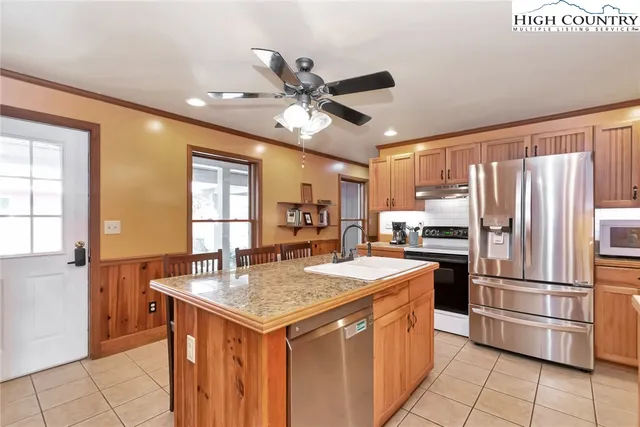 a kitchen with a refrigerator a sink and a refrigerator