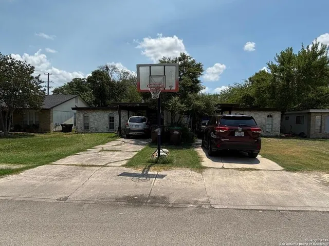 a car parked in front of a house
