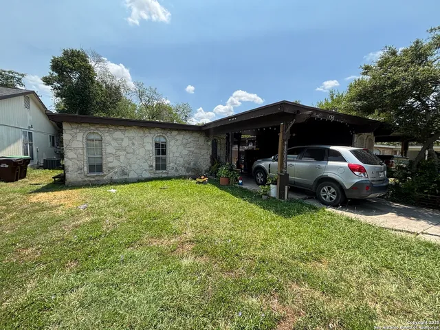 a view of a car parked in the yard