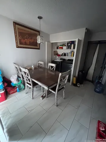 a dining room with furniture and closet