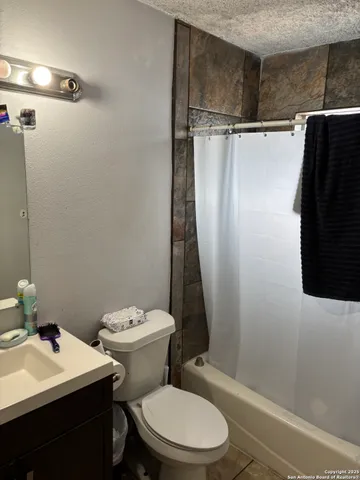 a white toilet sitting next to a bathroom sink
