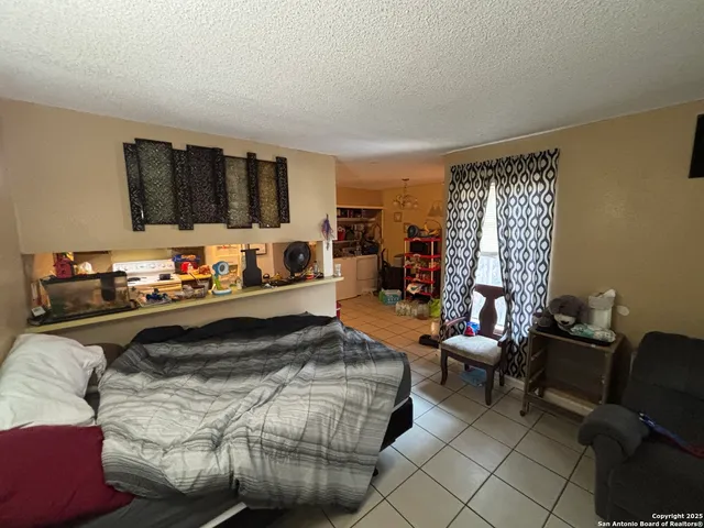 a bedroom with a bed and a couch