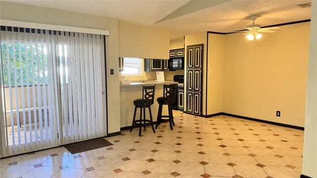 a kitchen that has a sink and a refrigerator