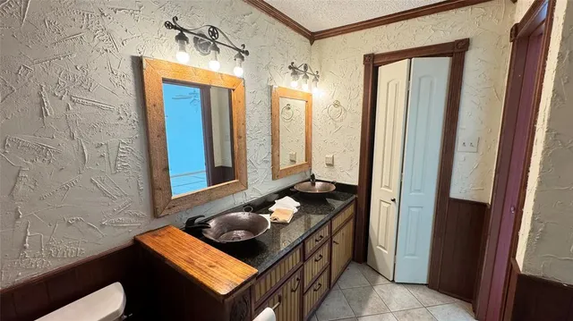 a kitchen with stainless steel appliances a stove and a sink