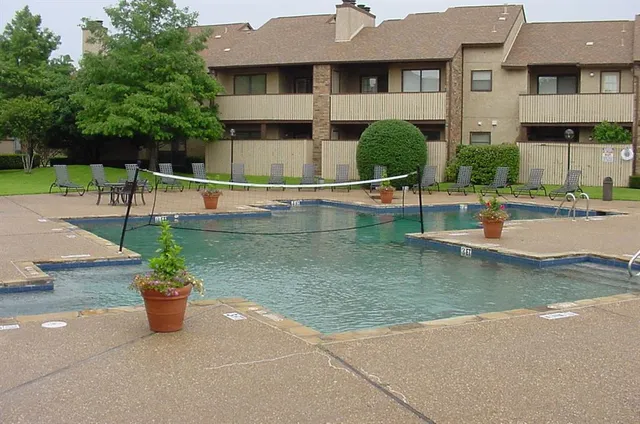 a view of a swimming pool with a patio