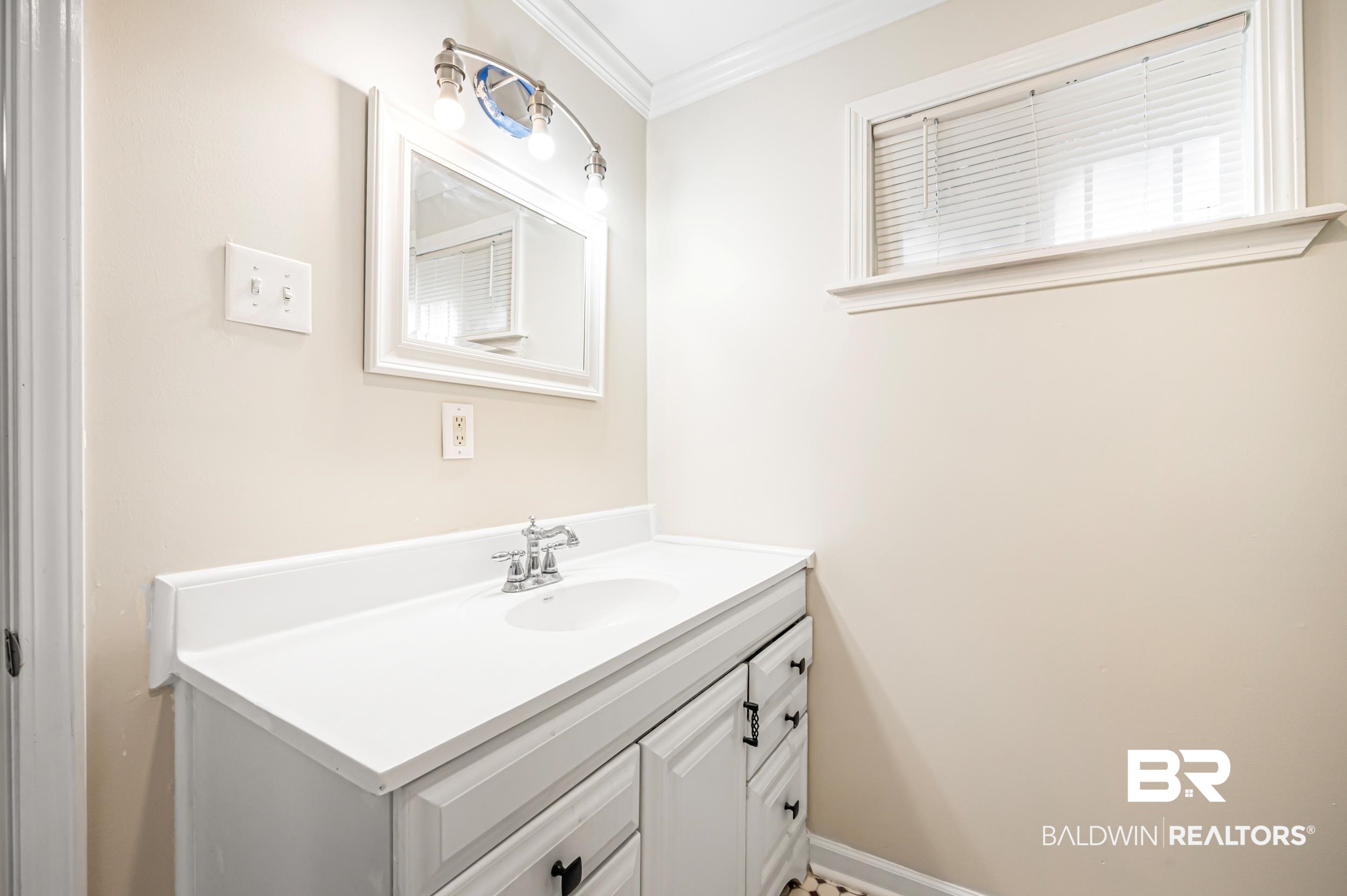 1605 Collier Avenue Bay Minette, AL 36507 - Photo 23 of 36 Bathroom with vanity and ornamental molding